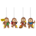 Four Bigfoot Outdoor ornaments shown together, including a Bigfoot holding a “Bigfoot Crossing” sign and map, a hiking Bigfoot with a backpack and binoculars, a camping Bigfoot with a mug beside a campfire, and a Bigfoot with a blue bandana holding a roasting stick.