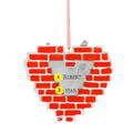 Back of Personalized Born to Fix ornament showing a silver personalization area with the example name Robert and year on a red brick wall background.