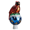 Red cardinal tree topper perched on a shiny blue ornament-shaped base with white snowy accents, gold details, and a silver glittered stem.
