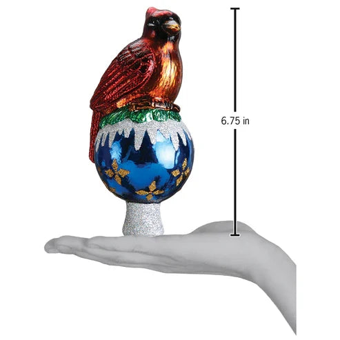 Cardinal Tree Topper shown standing on a hand for scale, measuring 6.75 inches tall.