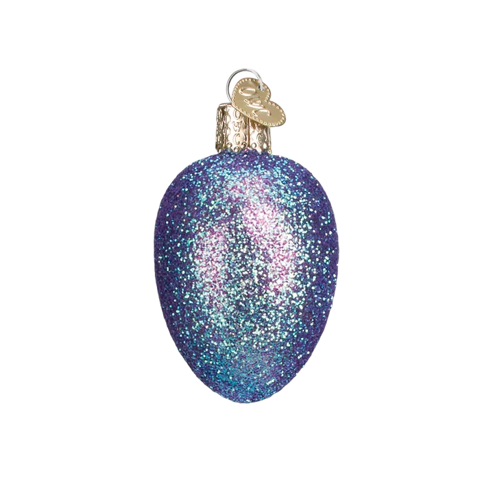 Decorative egg shaped ornament with glittery purple finish on a white background