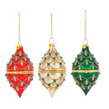 Glittered hinged drop ornaments shown in three assorted colors, featuring red, ivory, and green finial-style designs with gold glitter trim and green jewel accents.