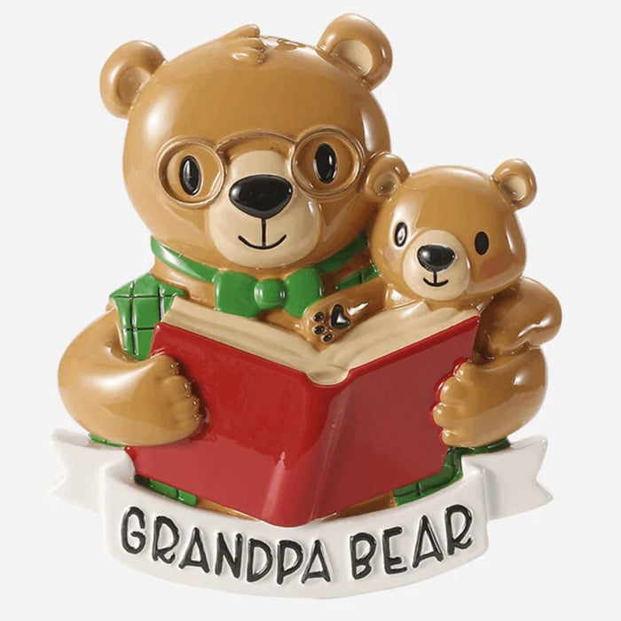 Decorative ornament of a bear reading a book with a smaller bear on its lap, labeled 'Grandpa Bear'.