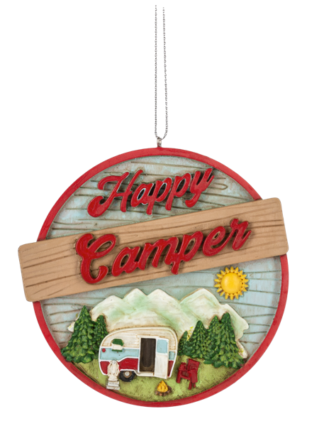 Round camper ornament with a red border, vintage trailer, pine trees, mountains, sunshine, and the phrase “Happy Camper.”