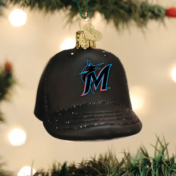 Marlins glass baseball cap ornament hanging on a tree