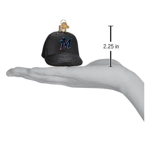 Black cap ornament with Marlins logo on a hand palm, showing size measurement.