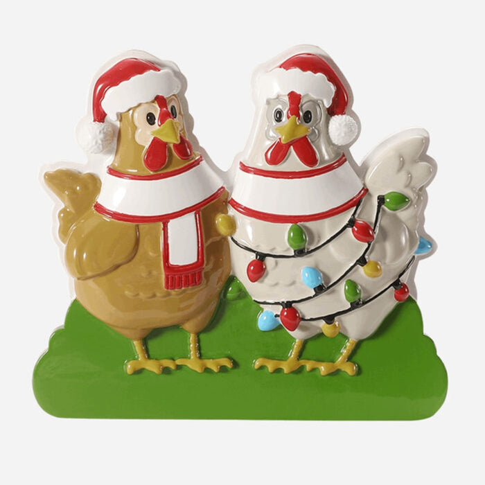 Two Christmas-themed chicken ornament with lights on a green base.