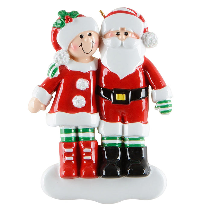 Decorative figurine of a couple in Christmas-themed outfits on a white background