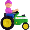 Decorative ornament of a person on a green tractor with personalized text, on a white background.