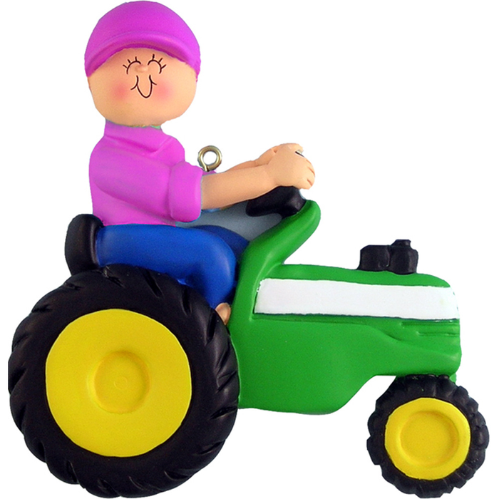 Ornament of a person driving a green tractor with a pink hat on a white background