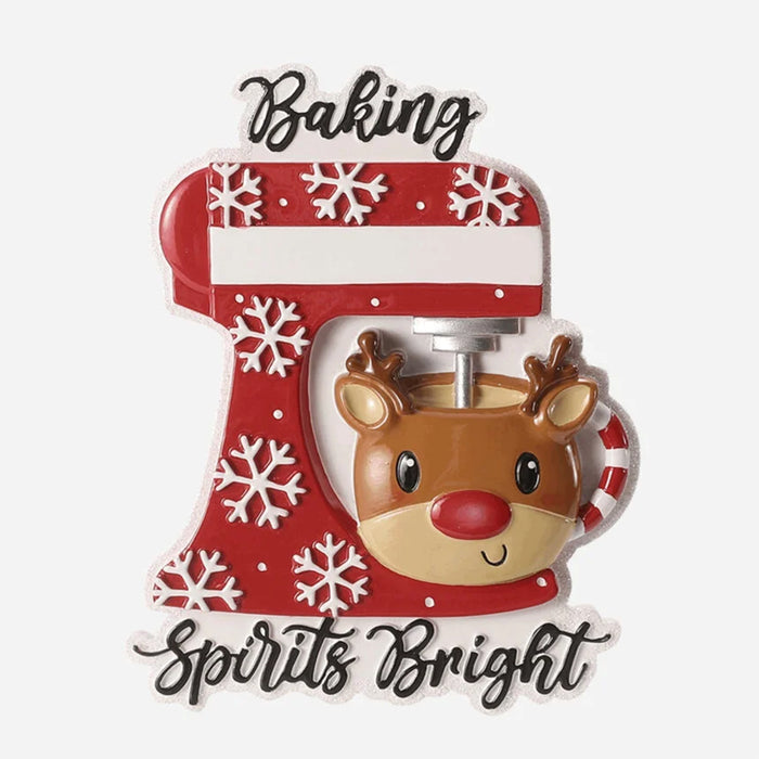 Decorative kitchen mixer Ornament with a reindeer design and text 'Baking Spirits Bright' on a white background.