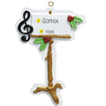 Decorative music stand ornament with musical notes and text on a white background