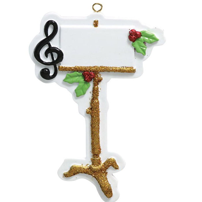 Decorative Christmas ornament with a treble clef and music stand on a white background