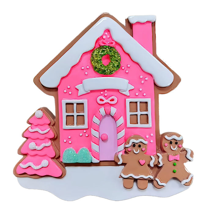 Decorative gingerbread house with pink walls, white roof, and gingerbread men on a white background