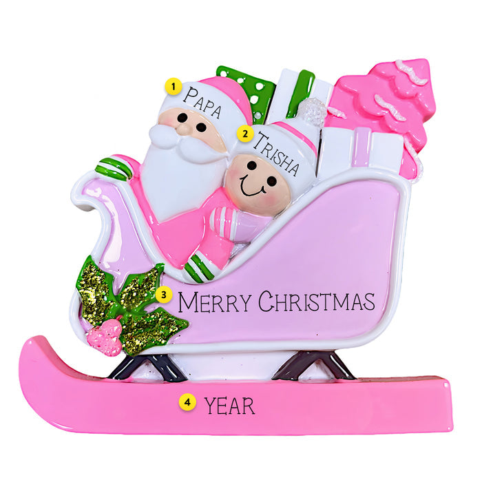 This playful design features Santa riding in a bright pink sleigh filled with colorful gifts and a festive tree, with a smiling helper riding along.