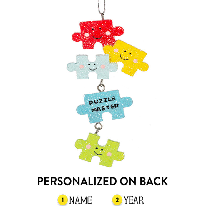 Colorful puzzle piece ornament with smiling faces on a white background