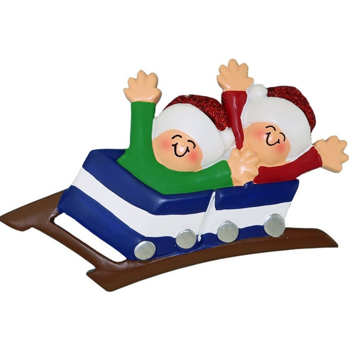 Two people in a rollercoaster ride ornament on a white background