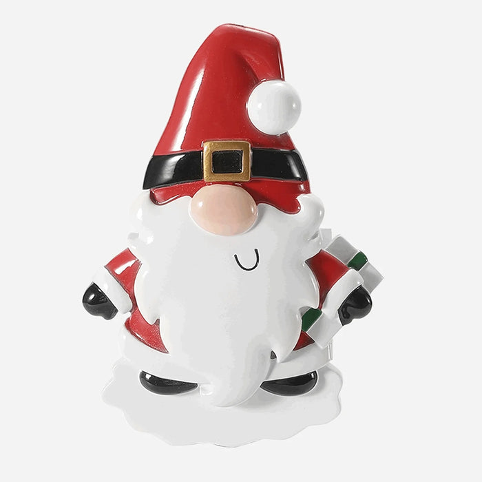 Decorative gnome Santa Ornament with red hat and white beard on a light gray background