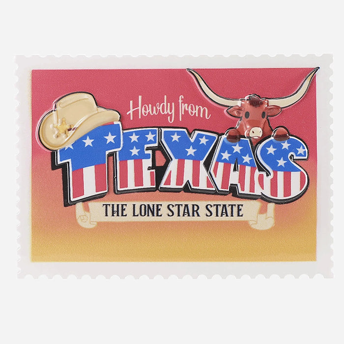 Decorative ornament with 'Howdy from Texas' text and a longhorn cow on a red and yellow background.