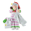 Decorative ornament of a young girl in pj's with a bunny, on a white background