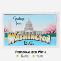 Post Card Shape ornament with Washington D.C. landmarks and cherry blossoms on a blue background. Can be personalized