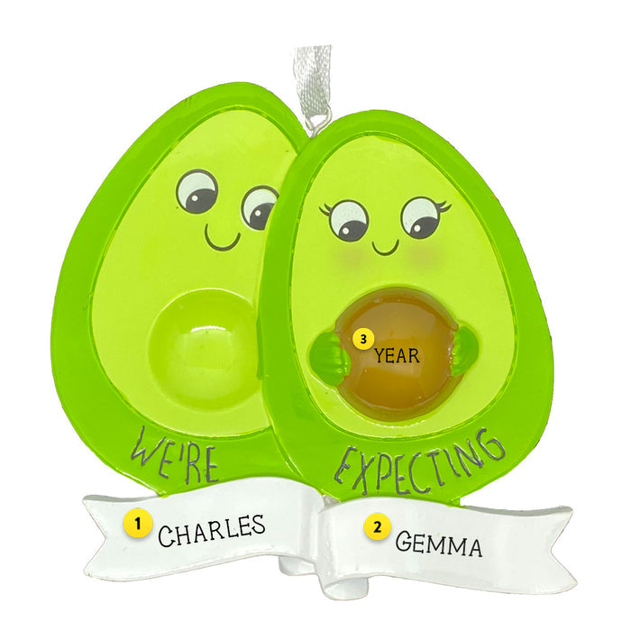 Personalized Pregnancy announcement  Couple ornament with the words We're Expecting and mom holding an avocado pit