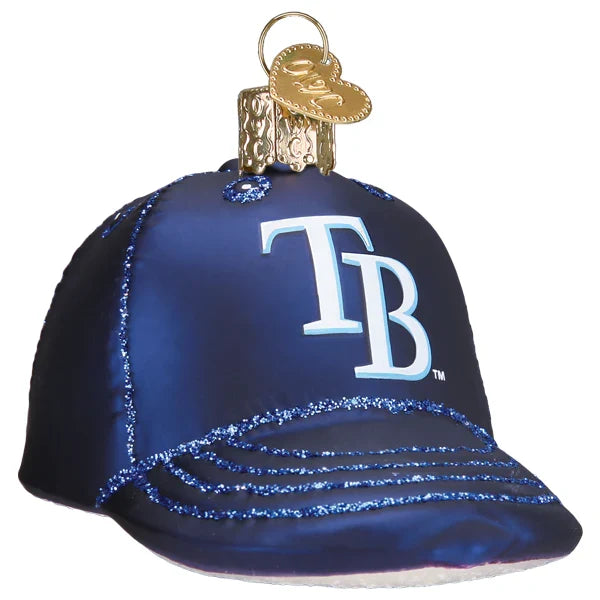 Decorative glass ornament shaped like a blue baseball cap with 'TB' logo on a white background