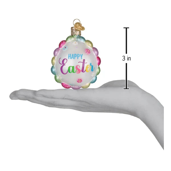 Easter egg ornament with 'Happy Easter' text, held in a hand for scale, on a white background.