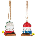 Two S’more Wintertime ornaments shown together, each featuring a marshmallow snowman-style figure on a graham cracker base dressed for winter, with one wearing a green trapper hat and red scarf and the other wearing a red hat and blue scarf.