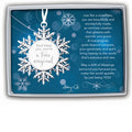 White snowflake ornament with ribbon hanger and round center tag reading “God bless you, you’re a true original,” displayed in a gift box with blue sentiment card.